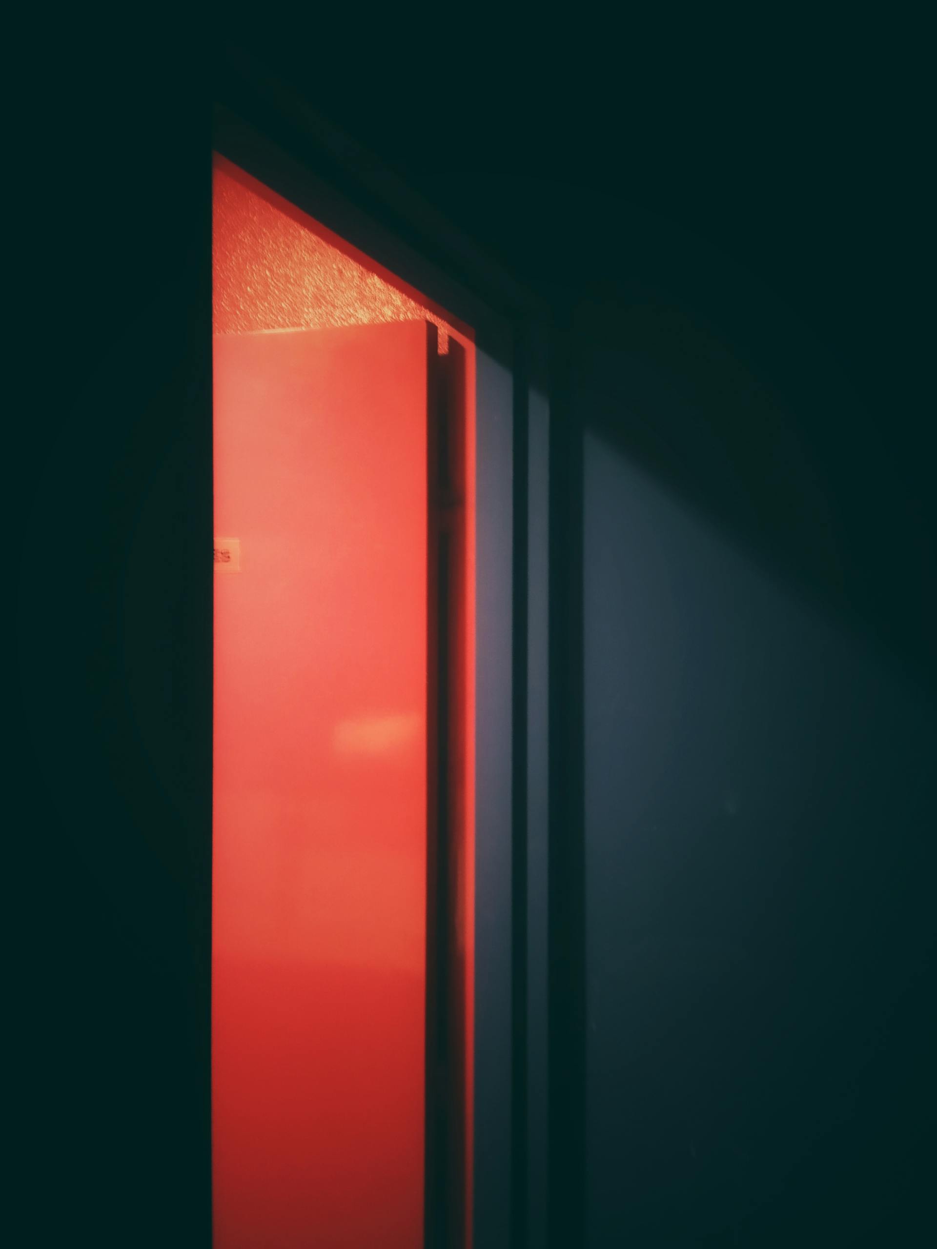 An Open Red Flush Door